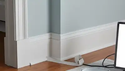 Professional interior trim painting in Wellesley, MA showcasing precise lines and detailed finish work
